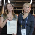 Anastasia Christine Kauerhof receiving her award from Professor Kate Loveland - SRB August 2018 Conference.