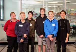 L-R: Teacher Julie McDonald, Eltham College students Jude Revill, Jo Middleton, Rhys Barwise, and Ethan Lonsdale, and Steph Huang at Hudson Institute during the BrainSTEM Innovation Challenge.