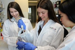 Students from Ivanhoe Girls' Grammar School  who created the school's inaugural Early Career Ovarian Cancer Research Travel Award tour the labs at Hudson Institute.