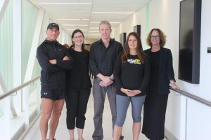 Alice West, Professor Brendan Jenkins and Professor Elizabeth Hartland with the Metafit team presenting the Daniel Wilson Metafit PhD Scholarship