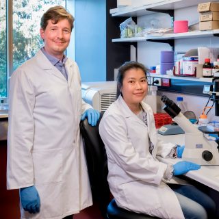Dr Robin Hobbs in the lab with PhD student Mai La.