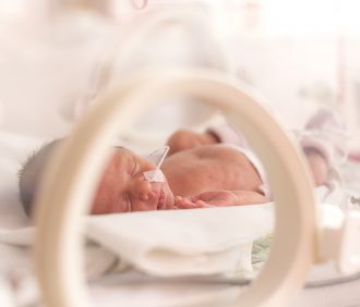 Premature baby in incubator