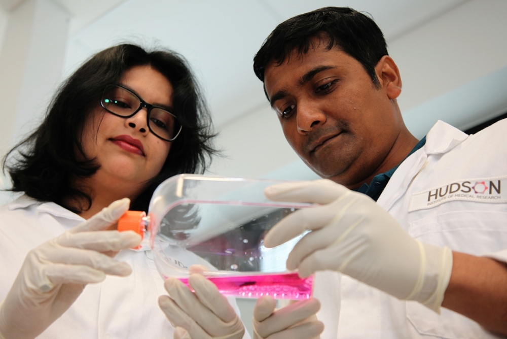 Shayanti and Kallyanashis holding stem cells conducting POP research at Hudson Institute