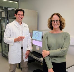 Dr Sam Forster and Professor Elizabeth Hartland testing the genomic sequencer at Hudson Institute of Medical Research