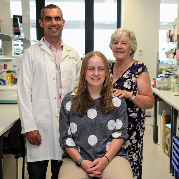 Dr Jason Cain in his lab with supporter Mrs Ann Lorden and her granddaughter, Ella, an osteosarcoma survivor. The Lorden family story. 