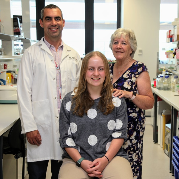 Dr Jason Cain in his lab with supporter Mrs Ann Lorden and her granddaughter, Ella, an osteosarcoma survivor. The Lorden family story.