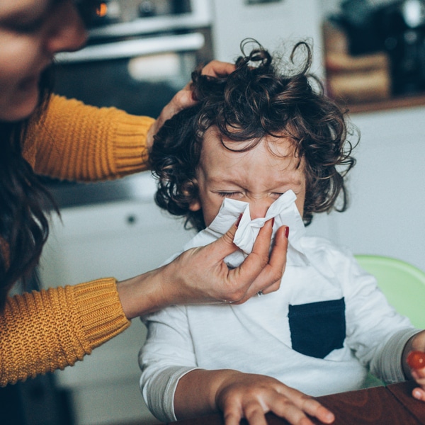 Child with runny nose to illustrate points made by Influenza expert, A/Prof Michelle Tate shares the latest on the flu season 2023 