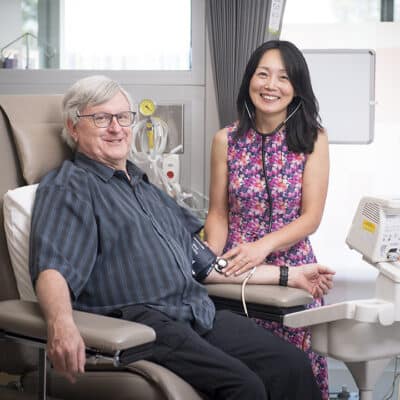 Associate Professor Jun Yang and clinical trial patient David
