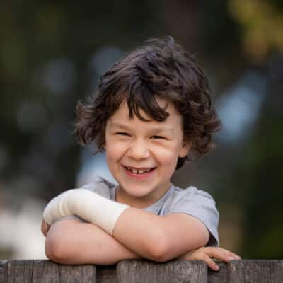 Luca Hall-Boggia a cancer survivor smiling at Hudson Institute. Picture Courtesy Jason Edwards /Herald Sun