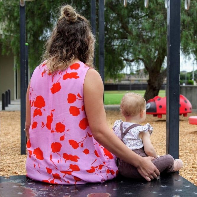 Jess sitting with baby daughter