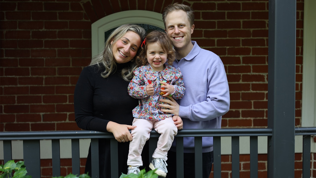 L-R: Jessica Clark, ovarian cancer survivor, at home with husband Ben and daughter Matilda