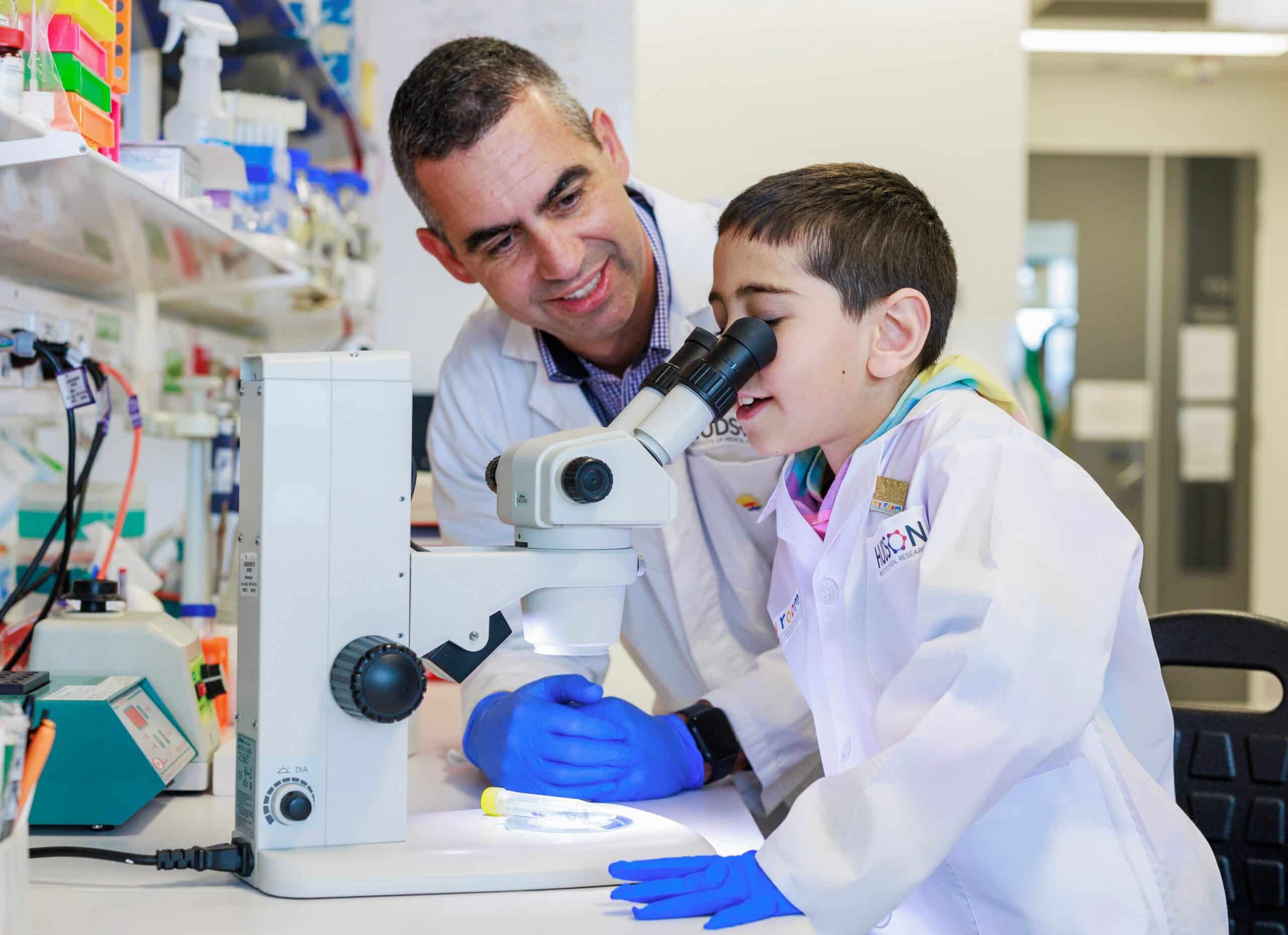 L-R: Associate Professor Jason Cain with Eli Mohibi. Photo courtesy of Aaron Francis / Herald Sun